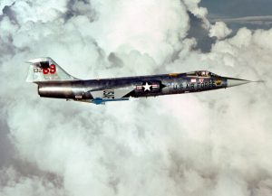 An air-to-air right side view of an F-104 Starfighter aircraft carrying two AIM-9J Sidewinder missiles. The aircraft, from the 69th Tactical Fighter Training Squadron, 58th Tactical Training Wing, 12th Air Force, is involved in Tactical Training Luke.